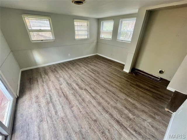 1117 Redman Blvd, Saint Louis, MO 63138 - unfurnished bedroom with wood finished floors and wainscoting