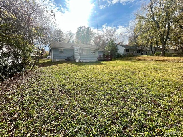 1117 Redman Blvd, Saint Louis, MO 63138 - view of grassy yard featuring a wooden deck