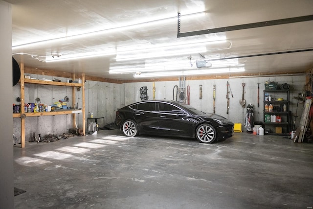 12332 Triple E Ln, Berger, MO 63014 - garage with a garage door opener and a workshop area