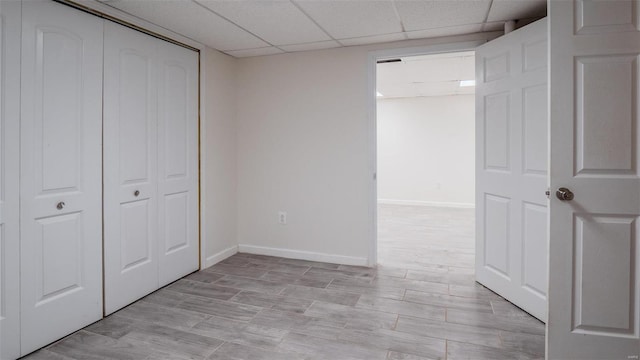 26380 Pebble Creek Dr, Warrenton, MO 63383 - unfurnished bedroom featuring baseboards, a closet, and a paneled ceiling
