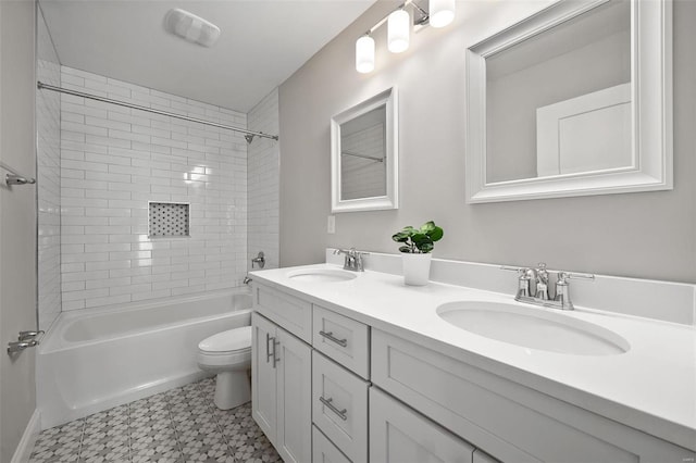 bathroom with toilet, tile patterned floors, shower / bath combination, and double vanity