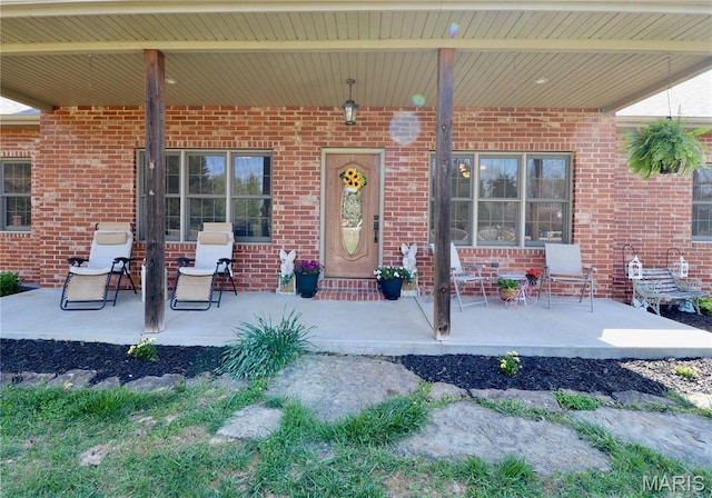 18921 Pleasant View Ln, Lebanon, MO 65536 - doorway to property with brick siding and a porch