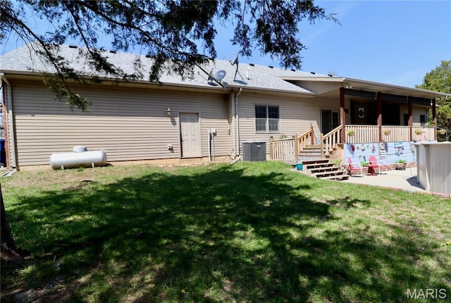 18921 Pleasant View Ln, Lebanon, MO 65536 - rear view of property with central air condition unit, a lawn, a patio, and a deck