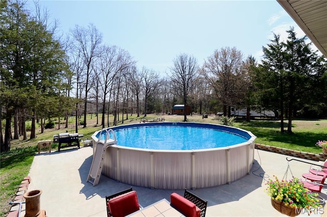 18921 Pleasant View Ln, Lebanon, MO 65536 - swimming pool featuring a patio, a yard, and view of scattered trees