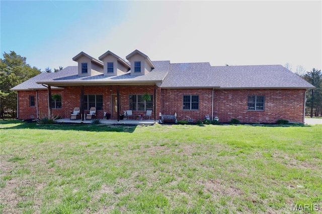 18921 Pleasant View Ln, Lebanon, MO 65536 - back of house featuring a yard, brick siding, and a patio area