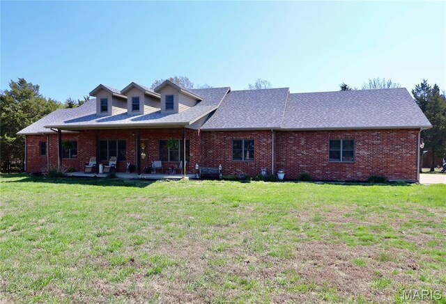 18921 Pleasant View Ln, Lebanon, MO 65536 - back of property featuring brick siding, a yard, a patio, and roof with shingles