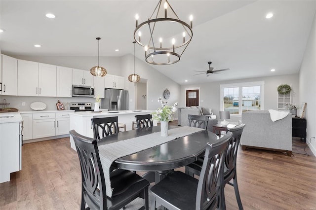 1162 Hawthorne Dr, Desloge, MO 63601 - dining room with lofted ceiling, ceiling fan, light wood-type flooring, recessed lighting, and a chandelier