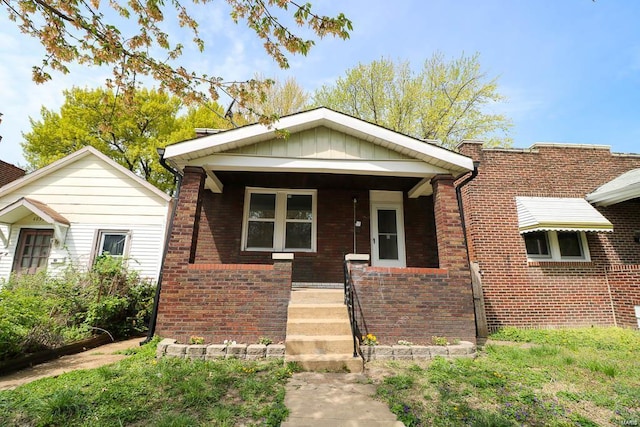 4031 Pennsylvania Ave, Saint Louis, MO 63118 - view of front facade with brick siding and a porch