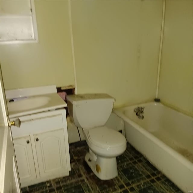 4341 Shreve Ave, Saint Louis, MO 63115 - full bath featuring toilet, a tub to relax in, vanity, and tile patterned floors