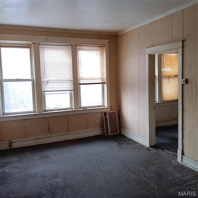 4341 Shreve Ave, Saint Louis, MO 63115 - spare room featuring dark carpet and crown molding