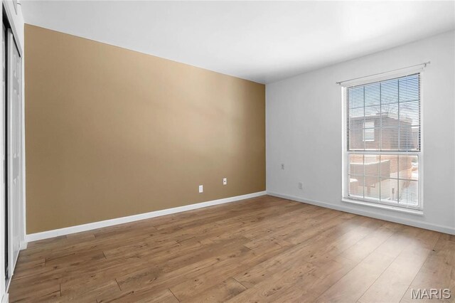 13453 Coliseum Dr Unit E, Chesterfield, MO 63017 - spare room with plenty of natural light, light wood-style flooring, and baseboards