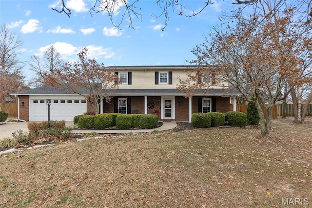 912 Westview Dr, Sikeston, MO 63801 - traditional home featuring a garage, driveway, and brick siding