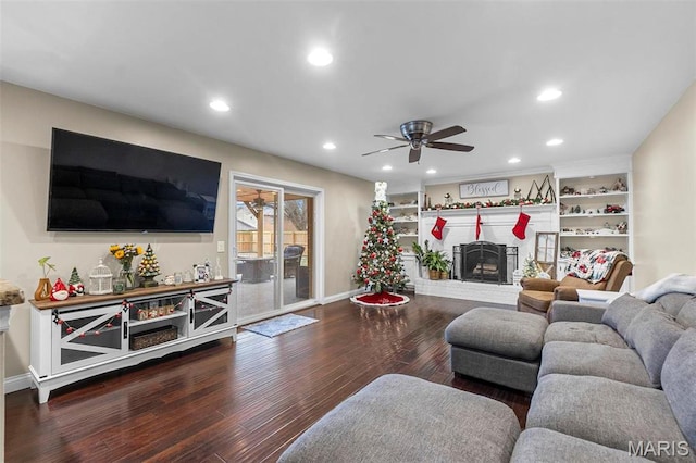 912 Westview Dr, Sikeston, MO 63801 - living room with wood finished floors, baseboards, a ceiling fan, a fireplace, and recessed lighting