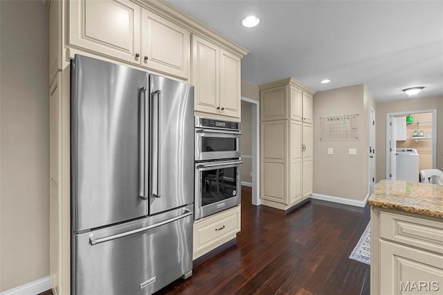 912 Westview Dr, Sikeston, MO 63801 - kitchen with stainless steel appliances, cream cabinets, baseboards, light stone counters, and recessed lighting