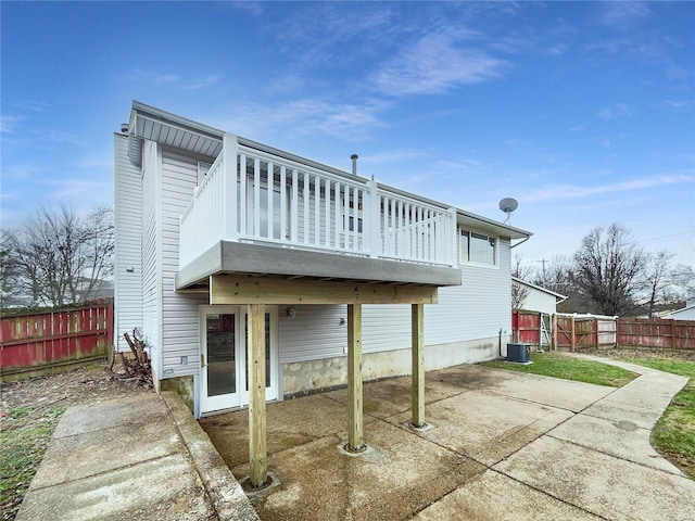 1253 Orion Way, Saint Peters, MO 63376 - back of house with a patio, cooling unit, a fenced backyard, and a chimney