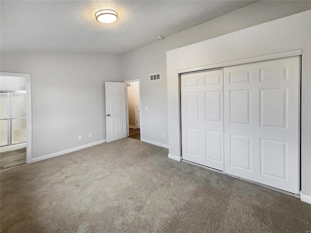 1253 Orion Way, Saint Peters, MO 63376 - unfurnished bedroom with carpet flooring, a closet, baseboards, and a textured ceiling