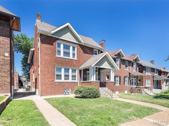 4983 Chippewa St, Saint Louis, MO 63109 - view of property with a chimney, brick siding, a front yard, and a residential view