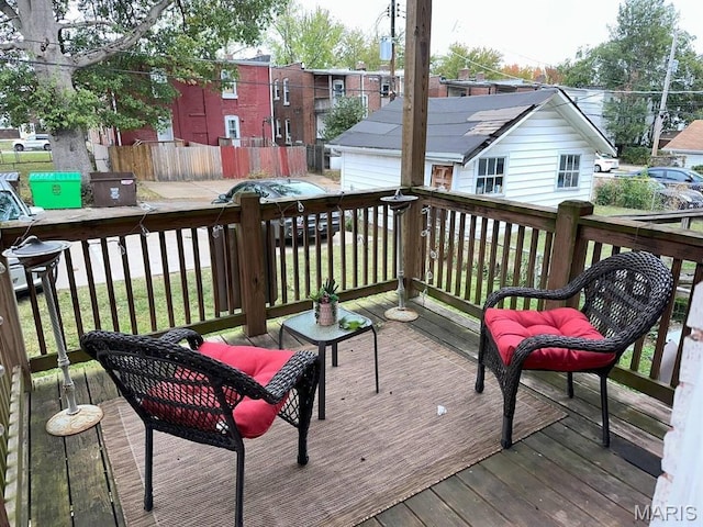 4983 Chippewa St, Saint Louis, MO 63109 - wooden deck featuring a detached garage