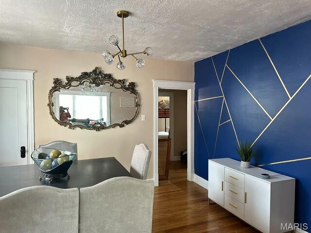 4983 Chippewa St, Saint Louis, MO 63109 - dining room with a textured ceiling, dark wood-style floors, and baseboards