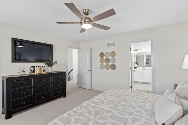 1035 Red Fox Dr, Eureka, MO 63025 - bedroom with light colored carpet, ensuite bath, baseboards, and a ceiling fan