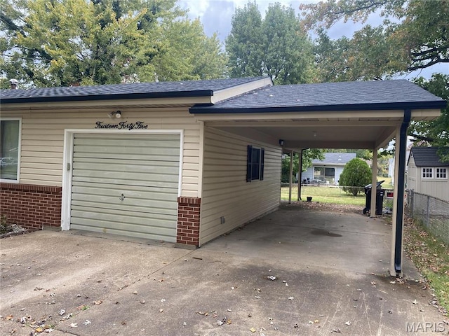 1445 Fairmeadows Ln, Saint Louis, MO 63138 - garage with concrete driveway and an attached carport