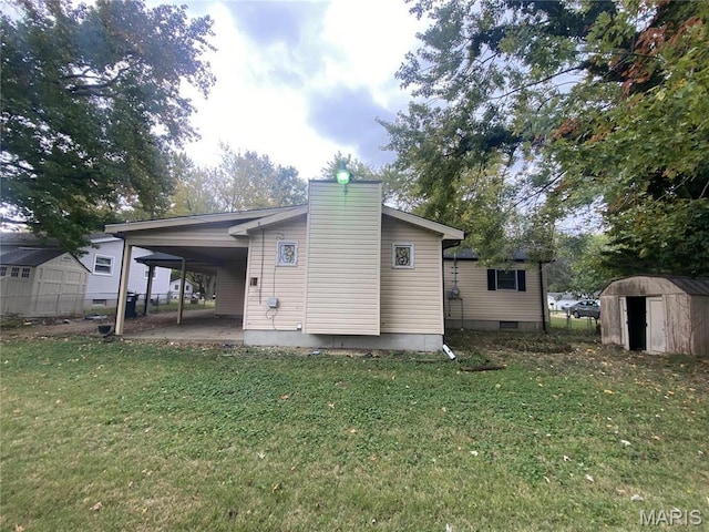 1445 Fairmeadows Ln, Saint Louis, MO 63138 - rear view of property with a yard and an attached carport