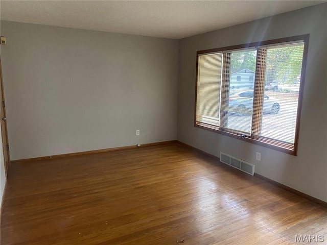 1445 Fairmeadows Ln, Saint Louis, MO 63138 - unfurnished room with wood finished floors and baseboards