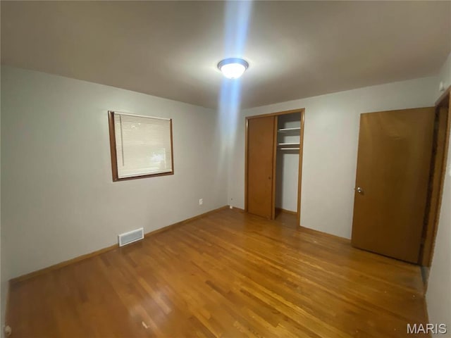 1445 Fairmeadows Ln, Saint Louis, MO 63138 - unfurnished bedroom featuring light wood-style flooring and a closet