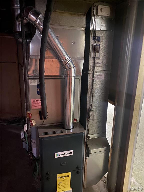 1445 Fairmeadows Ln, Saint Louis, MO 63138 - utility room with heating unit