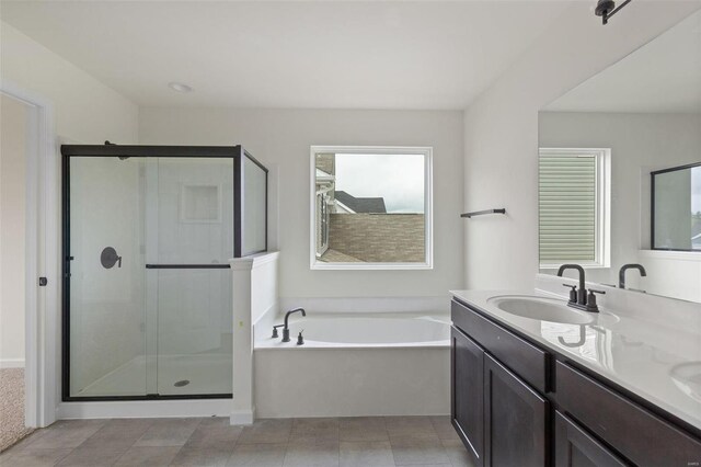 1741 Martingale Ln, Eureka, MO 63025 - full bathroom featuring a stall shower, a garden tub, and double vanity