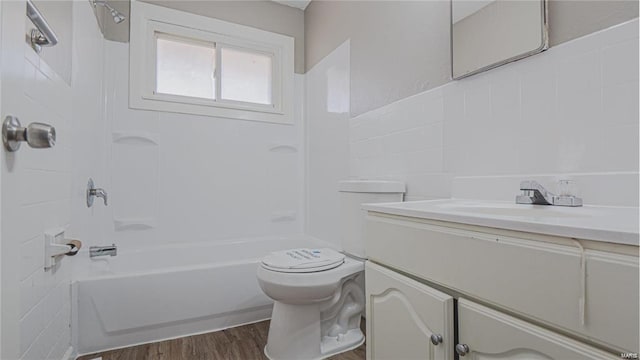 1370 Reale Ave, Saint Louis, MO 63138 - bathroom featuring shower / washtub combination, toilet, vanity, and wood finished floors