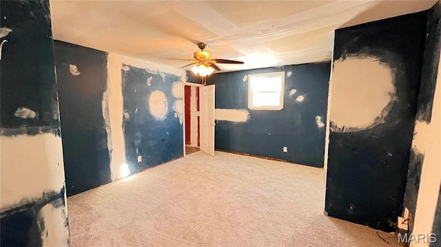 3222 W Tennyson Ave, Saint Louis, MO 63114 - carpeted empty room with a ceiling fan