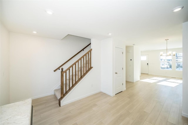 103 Cardow Dr Unit 169-605, Ofallon, MO 63368 - stairway featuring wood finished floors, a chandelier, baseboards, and recessed lighting