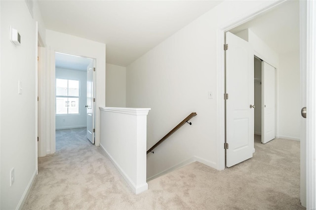 103 Cardow Dr Unit 169-605, Ofallon, MO 63368 - corridor with an upstairs landing, light colored carpet, and baseboards