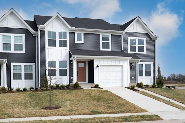 103 Cardow Dr Unit 169-605, Ofallon, MO 63368 - view of front of home featuring board and batten siding, a front lawn, concrete driveway, and an attached garage