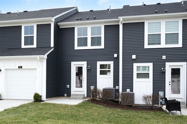 103 Cardow Dr Unit 169-605, Ofallon, MO 63368 - townhome / multi-family property featuring a front yard, a garage, entry steps, driveway, and central air condition unit
