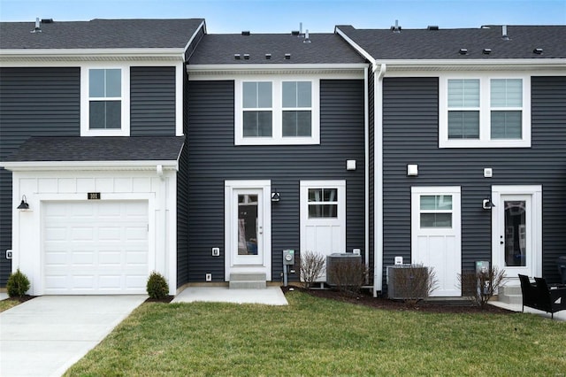 103 Cardow Dr Unit 169-605, Ofallon, MO 63368 - townhome / multi-family property featuring a front yard, driveway, and a garage