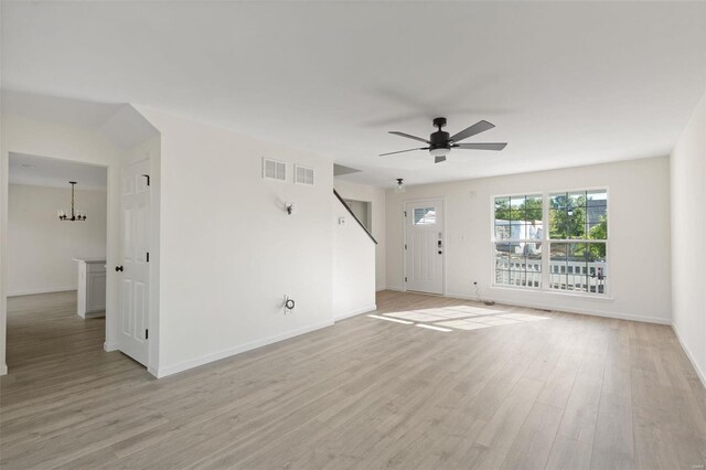 212 Westhaven Circle Dr, Wentzville, MO 63385 - unfurnished living room featuring light wood finished floors, baseboards, and a ceiling fan