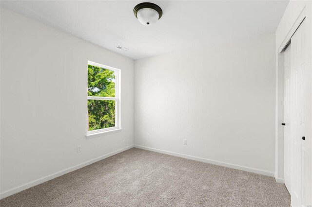 212 Westhaven Circle Dr, Wentzville, MO 63385 - unfurnished bedroom featuring carpet floors, a closet, and baseboards