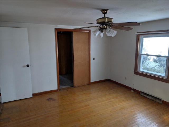 413 N 6th St, New Douglas, IL 62074 - unfurnished room with light wood-style floors, baseboards, and ceiling fan