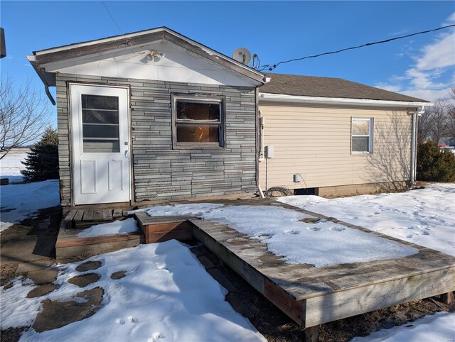 413 N 6th St, New Douglas, IL 62074 - snow covered back of property with stone siding