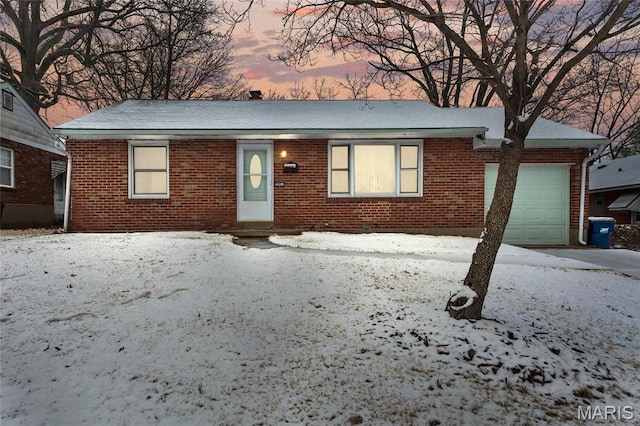 2031 Hildred Ave, Saint Louis, MO 63136 - ranch-style house with brick siding and a garage