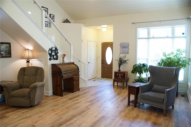 10 Anemone Rd, Lake Ozark, MO 65049 - entryway with light wood-style flooring, plenty of natural light, stairway, and baseboards