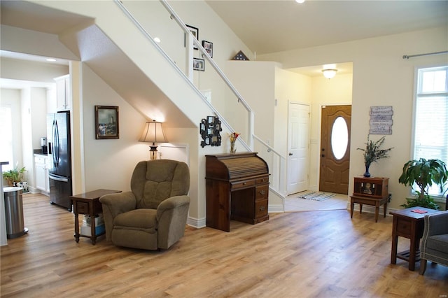 10 Anemone Rd, Lake Ozark, MO 65049 - foyer entrance with light wood finished floors, stairs, baseboards, and recessed lighting