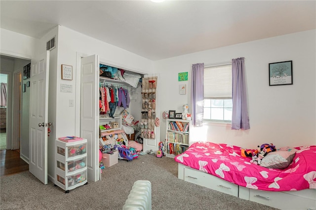 carpeted bedroom featuring a closet
