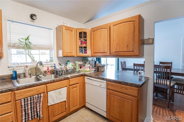 806 S Tebbetts, Belle, MO 65013 - kitchen with dishwasher, dark countertops, lofted ceiling, glass insert cabinets, and brown cabinets