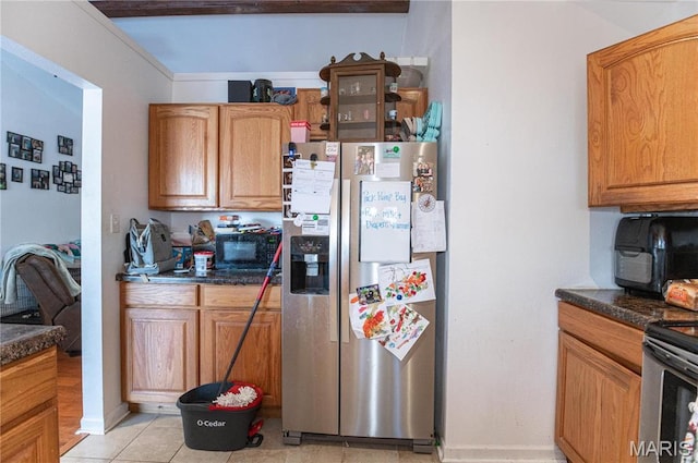 806 S Tebbetts, Belle, MO 65013 - kitchen featuring stainless steel appliances, dark countertops, and light tile patterned floors