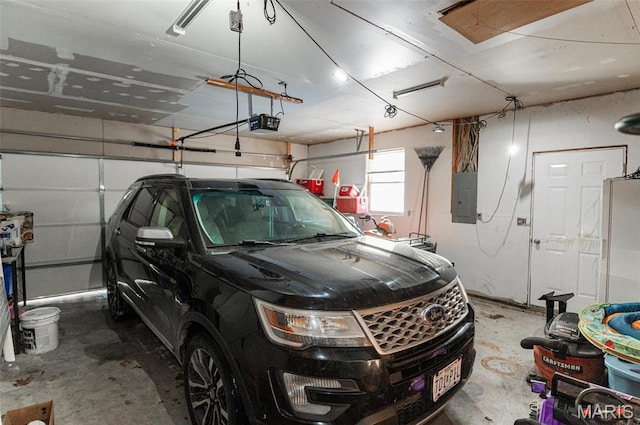 806 S Tebbetts, Belle, MO 65013 - garage with electric panel and a garage door opener