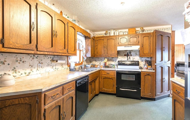 kitchen featuring electric range oven, dishwasher, under cabinet range hood, a sink, and brown cabinetry