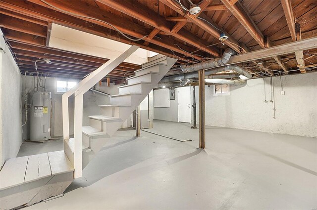 1100 Northdale Ave, Saint Louis, MO 63138 - below grade area featuring electric water heater and stairway